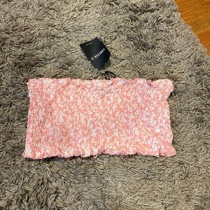 small pink and white patterned strapless crop top